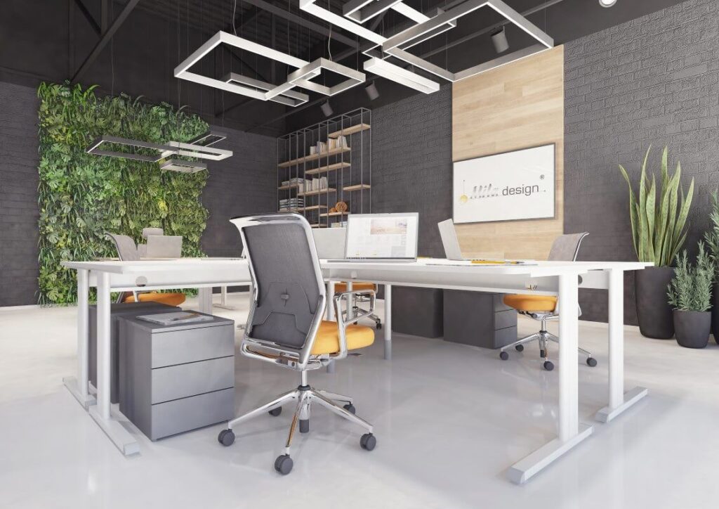 Nowoczesne biuro z biurkiem regulowanym elektrycznie, roślinami i designerskimi lampami.