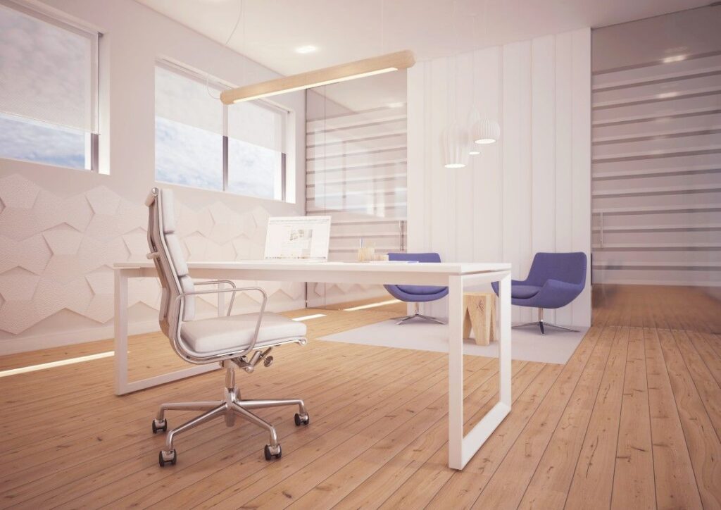 Nowoczesne biuro z eleganckim białym stołem wspartym na nogach od producenta nóg metalowych do stołów.