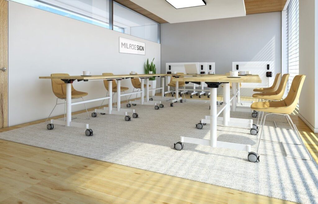 Nowoczesne biuro wyposażone w biurko regulowane elektrycznie oraz żółte krzesła.