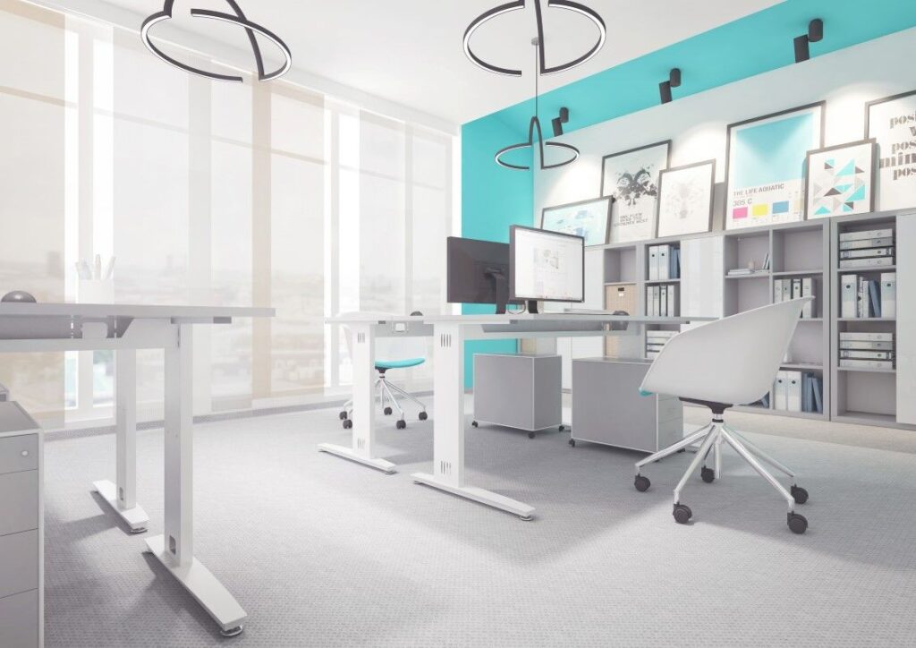 Jak działa biurko z podnoszonym blatem: teleskopowe kolumny w prowadnicach, napęd korbą lub silnikami; zakres 65–125 cm, nośność 70–120 kg.