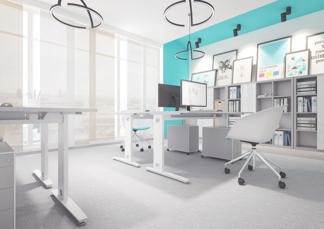 Jak działa biurko z podnoszonym blatem: teleskopowe kolumny w prowadnicach, napęd korbą lub silnikami; zakres 65–125 cm, nośność 70–120 kg.